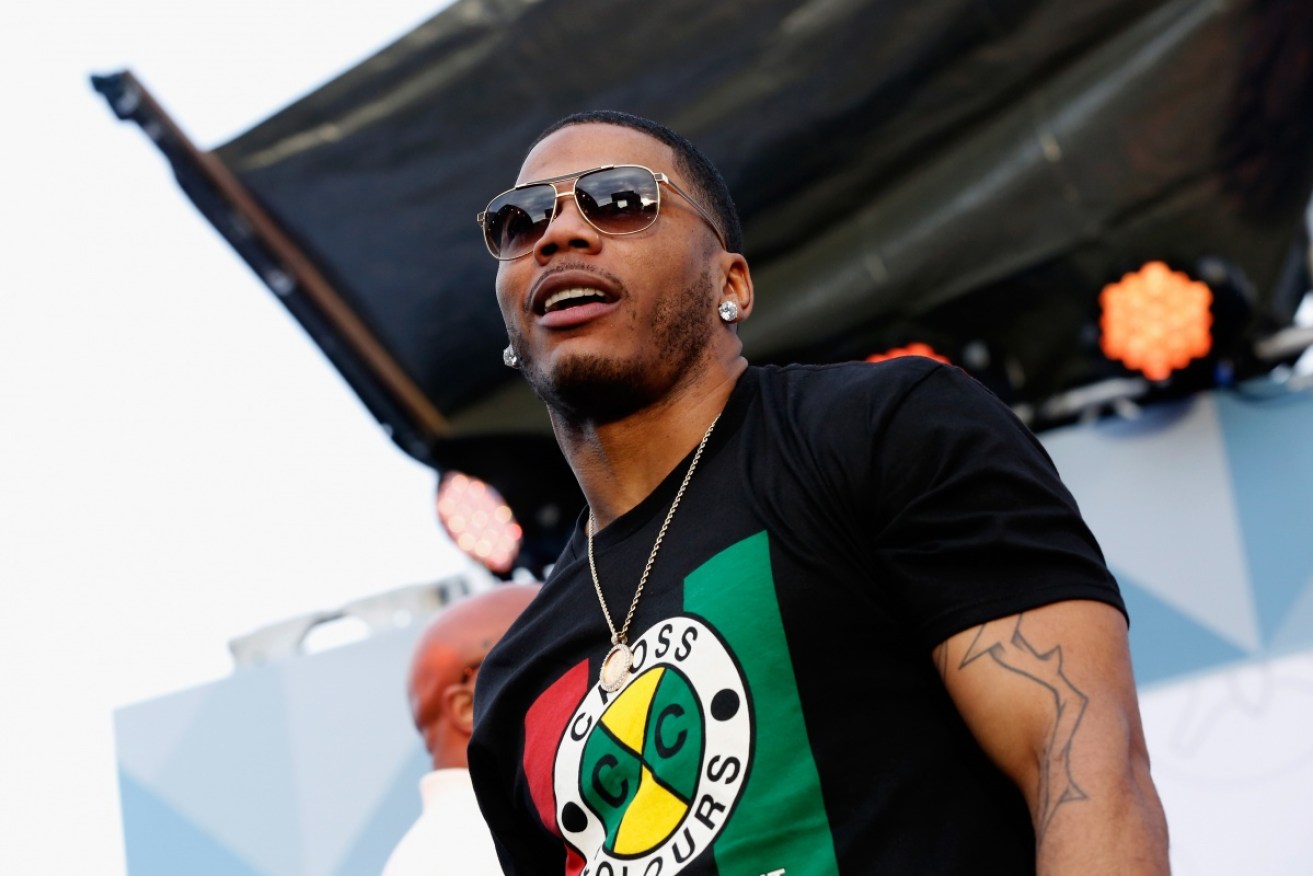 Nelly, whose real name is Cornell Iral Haynes Jr., spent the night behind bars after being accused of raping a fan on his tour bus.