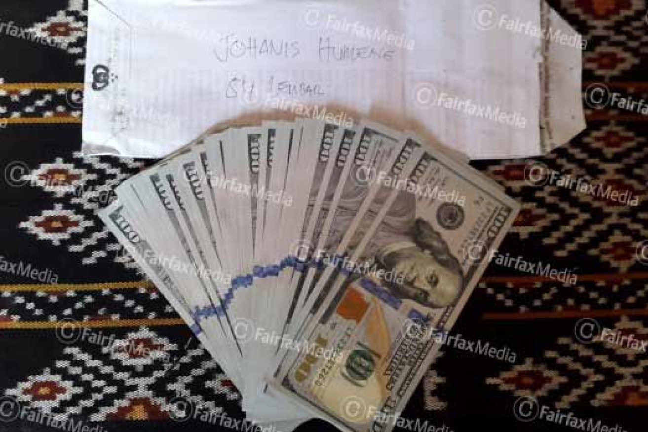 Cash which Indonesian Police took from people smugglers. They say it came from Australian official 'Agus'. Photo: Fairfax Media