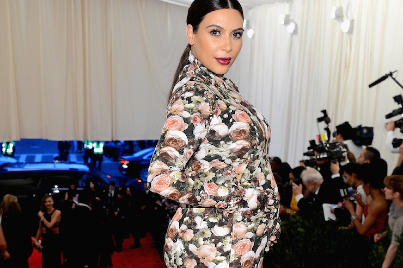 Kim Kardashian pregnant and dressed in her  drapes in 2013.