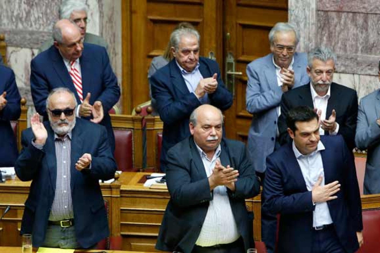 Greek government ministers applauded the referendum vote. Photo: AAP