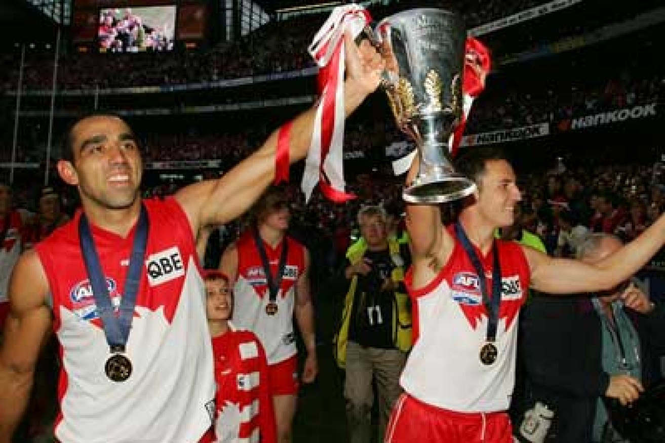 Adam Goodes and Tadhg Kennelly with the 2005 premiership cup. Photo: Getty