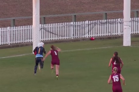 Young woman kicks goal of the year contender