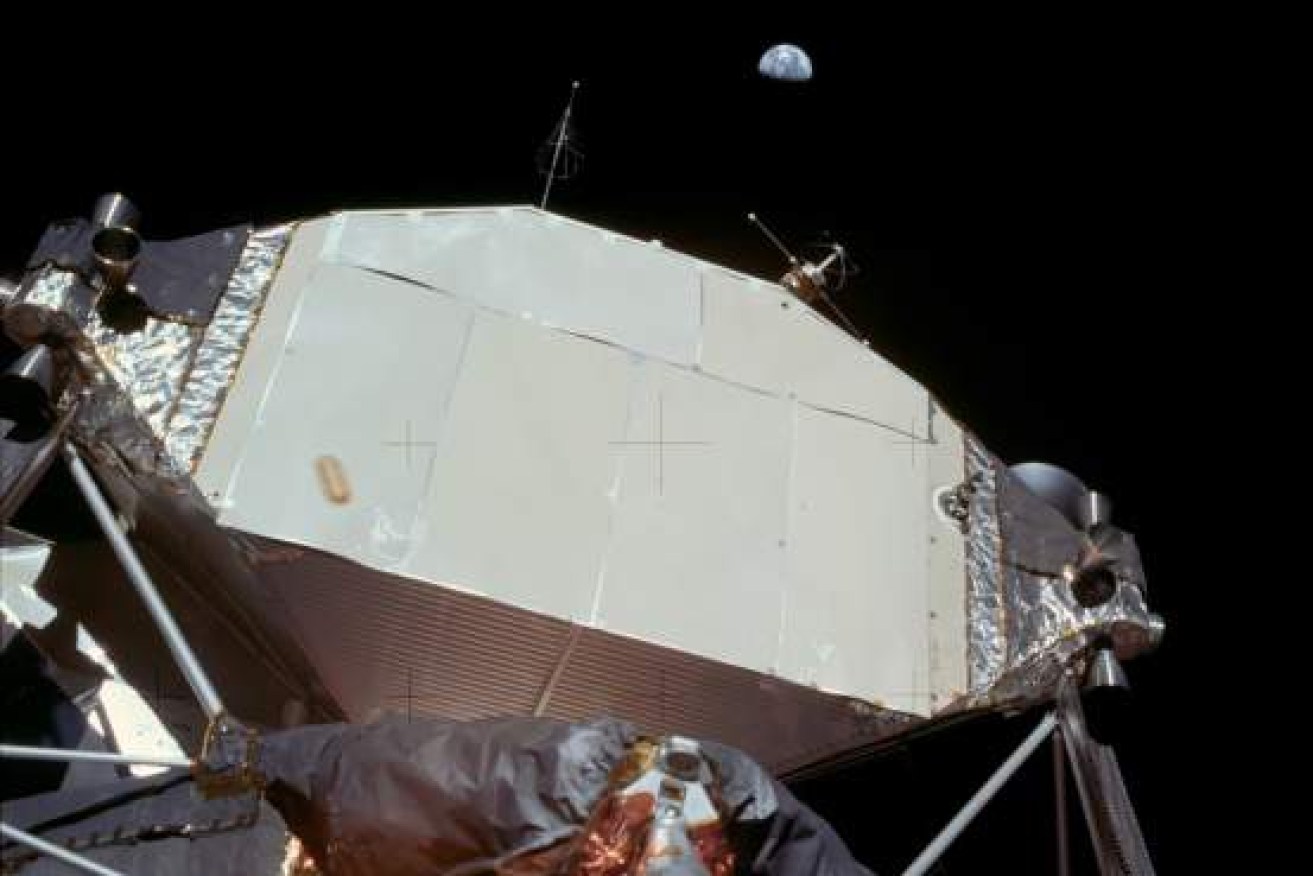 You can see the earth out in the distance, hovering above the lunar landing module. Photo: NASA