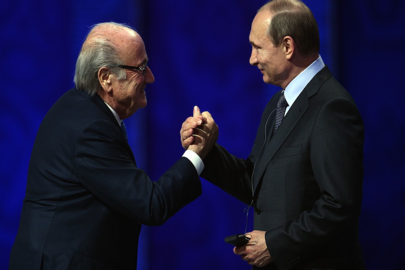 SAINT PETERSBURG, RUSSIA - JULY 25:  FIFA President Joseph S. Blatter shakes hands with Vladimir Putin, President of Russia during the Preliminary Draw of the 2018 FIFA World Cup in Russia at The Konstantin Palace on July 25, 2015 in Saint Petersburg, Russia.  (Photo by Dennis Grombkowski/Getty Images)
