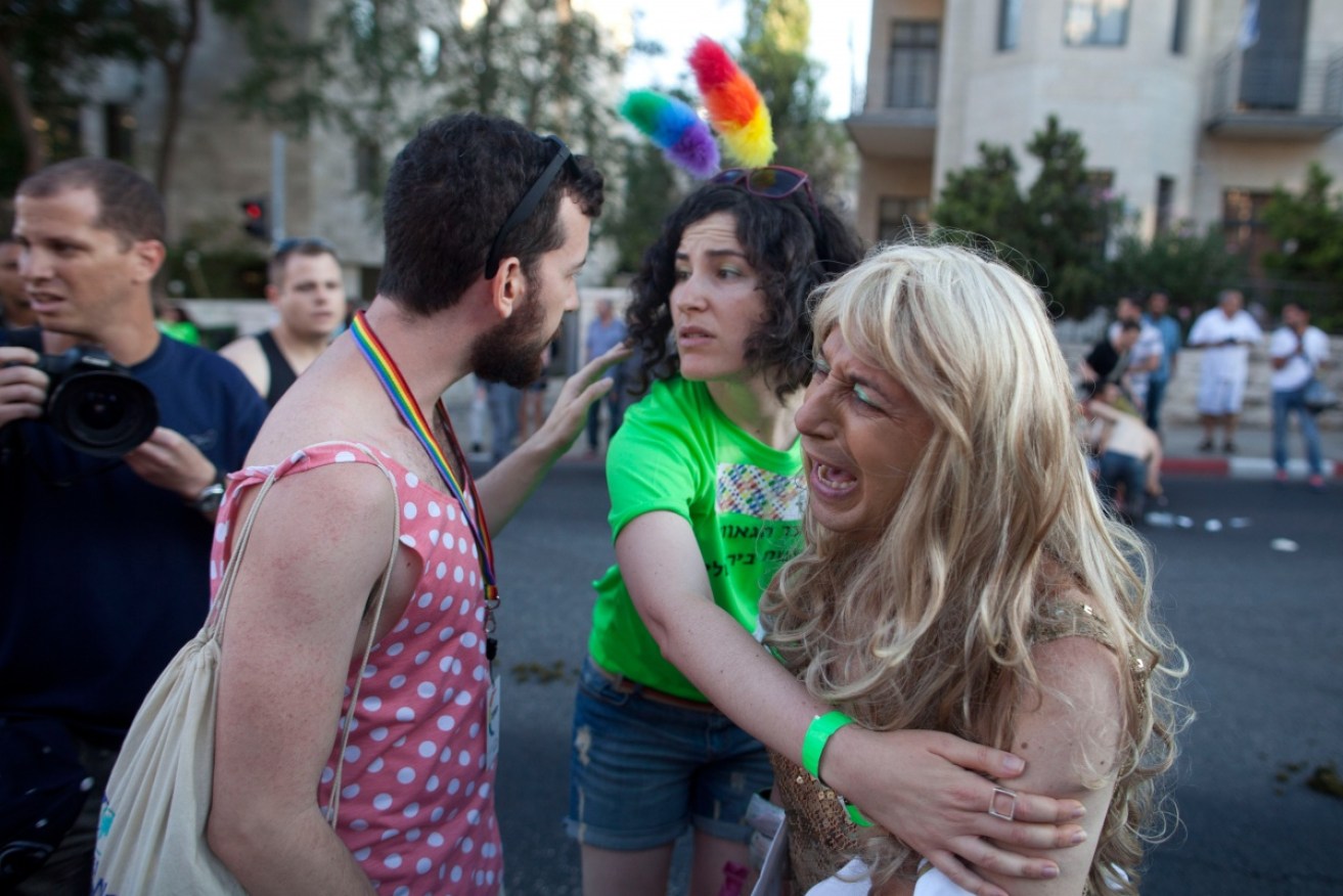 Tensions are high in Jerusalem between religious groups and gay advocates. Here they mourn the stabbings. Photo: Getty