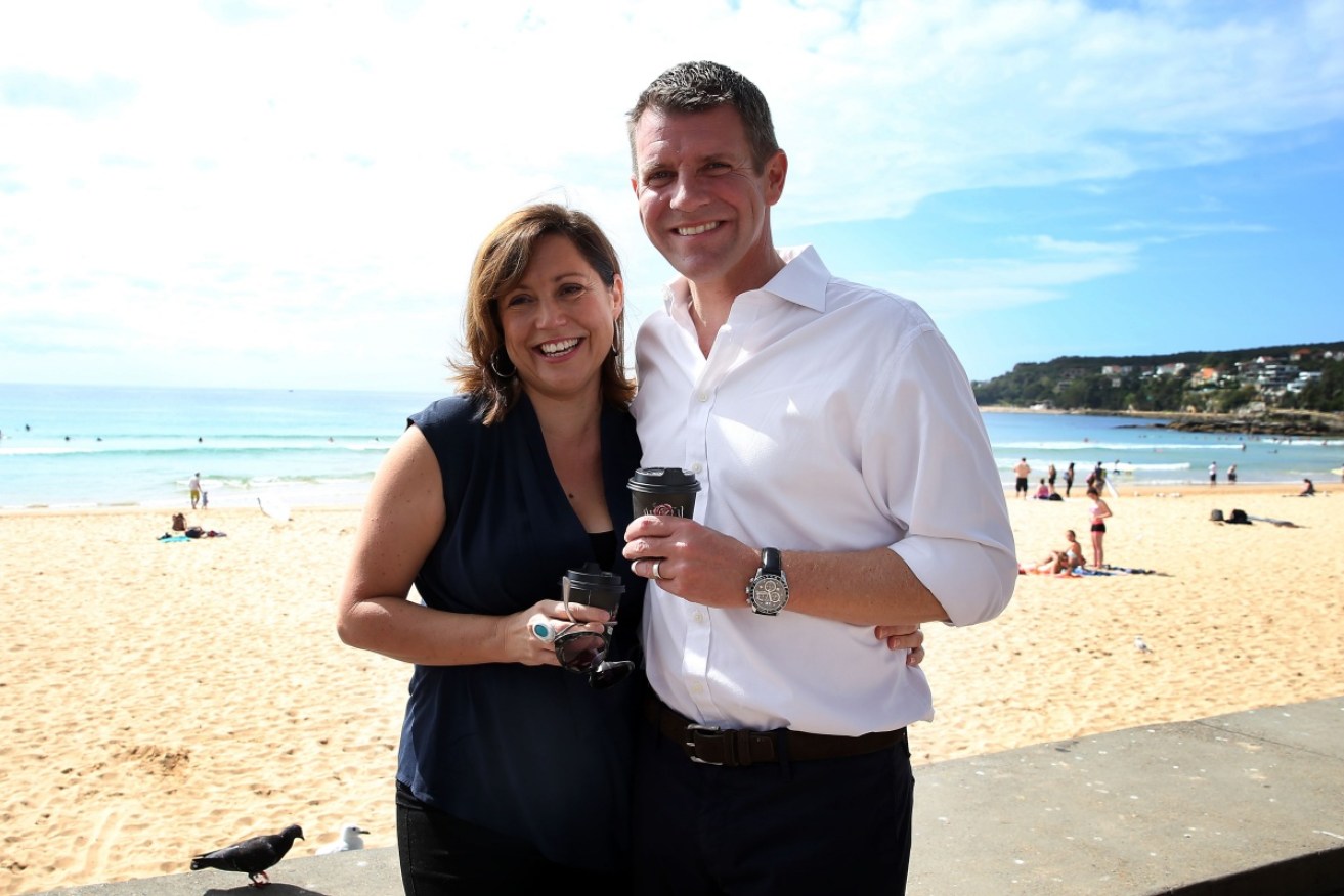 Mike Baird has coffee with his wife Kerryn. Mr Baird was leaving after a beachside coffee when he was caught. Photo: AAP