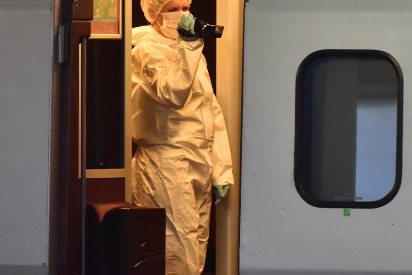 Investigators gather evidence on the train, which was carrying 550 passengers. Photo: Getty