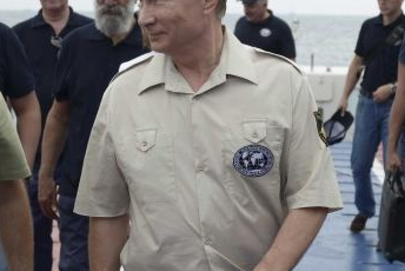 It was hard to tell is Putin's beige number or his smile was the brighter presence on the visit. Photo: ABC