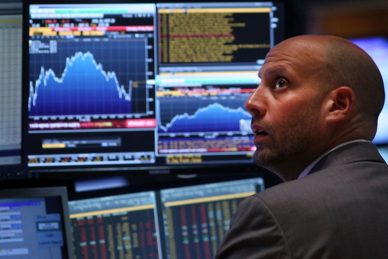NEW YORK, NY - AUGUST 24:  A trader works on the floor of the New York Stock Exchange (NYSE) on August 24, 2015 in New York City. As the global economy continues to react from events in China, markets dropped significantly around the world on Monday. The Dow Jones industrial average briefly dropped over 1000 points in morning trading and closed down 588 points.  (Photo by Spencer Platt/Getty Images)