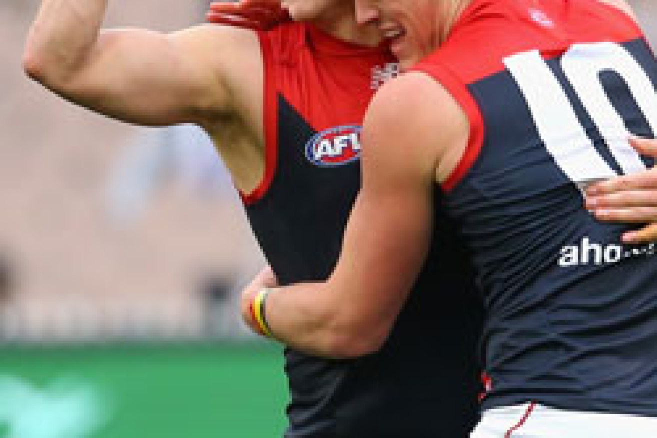 Vince (L) is hugged by Melbourne team-mate Angus Brayshaw. Photo: Getty