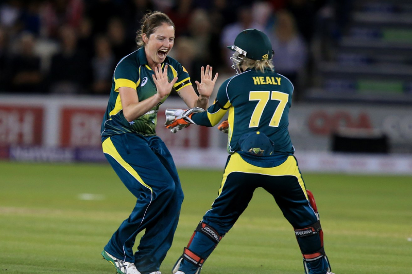 Rene Farrell (left) celebrates taking the wicket of England's Heather Knight.