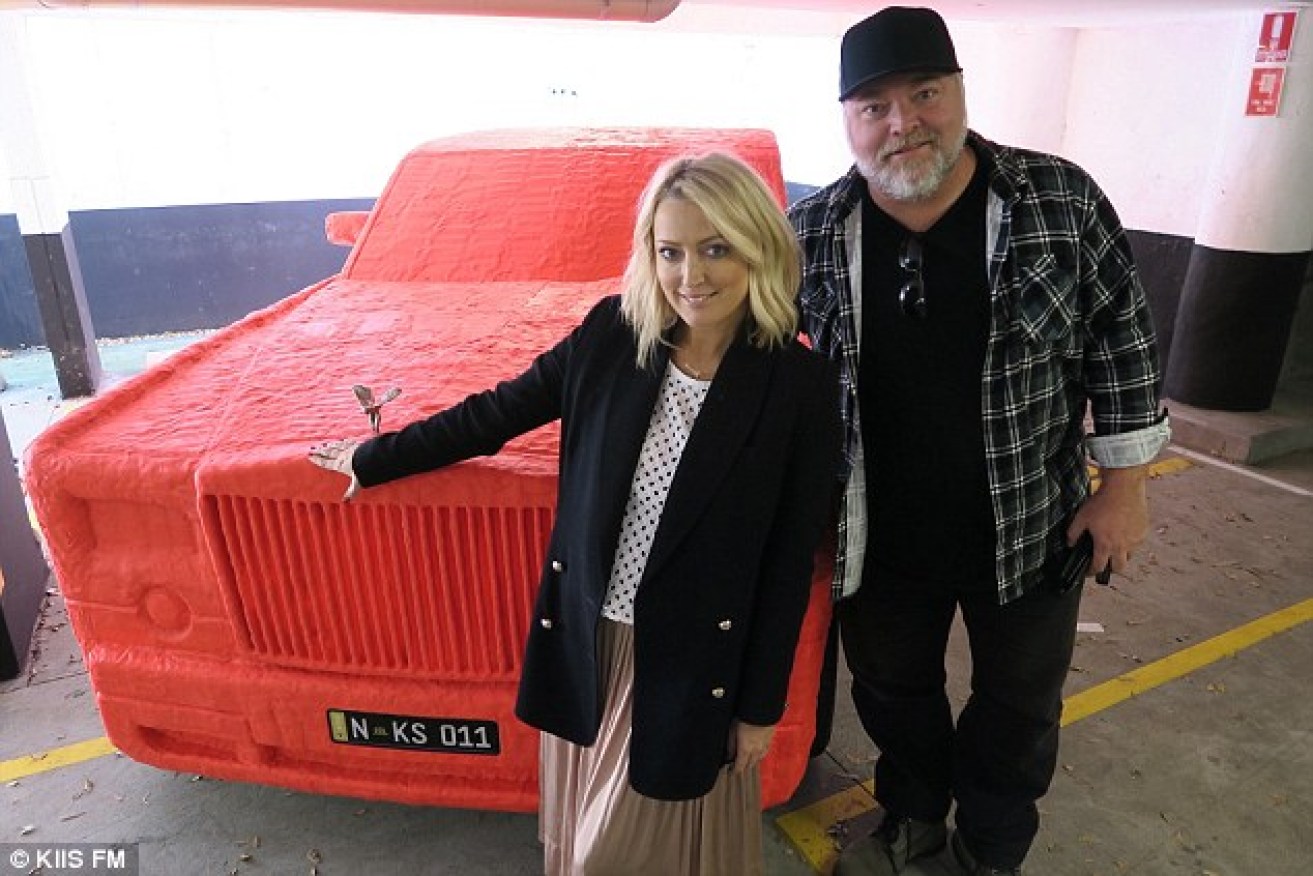 Kyle and Jackie O in front of the gag car. Kiis FM