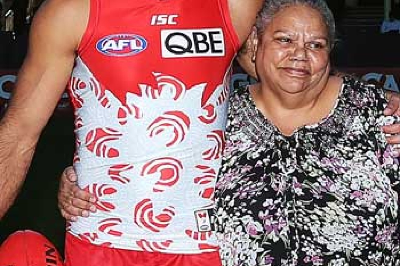 Goodes with his mother, Lisa Sansbury, who designed the Swans Indigenous Round guernsey. Photo: Getty