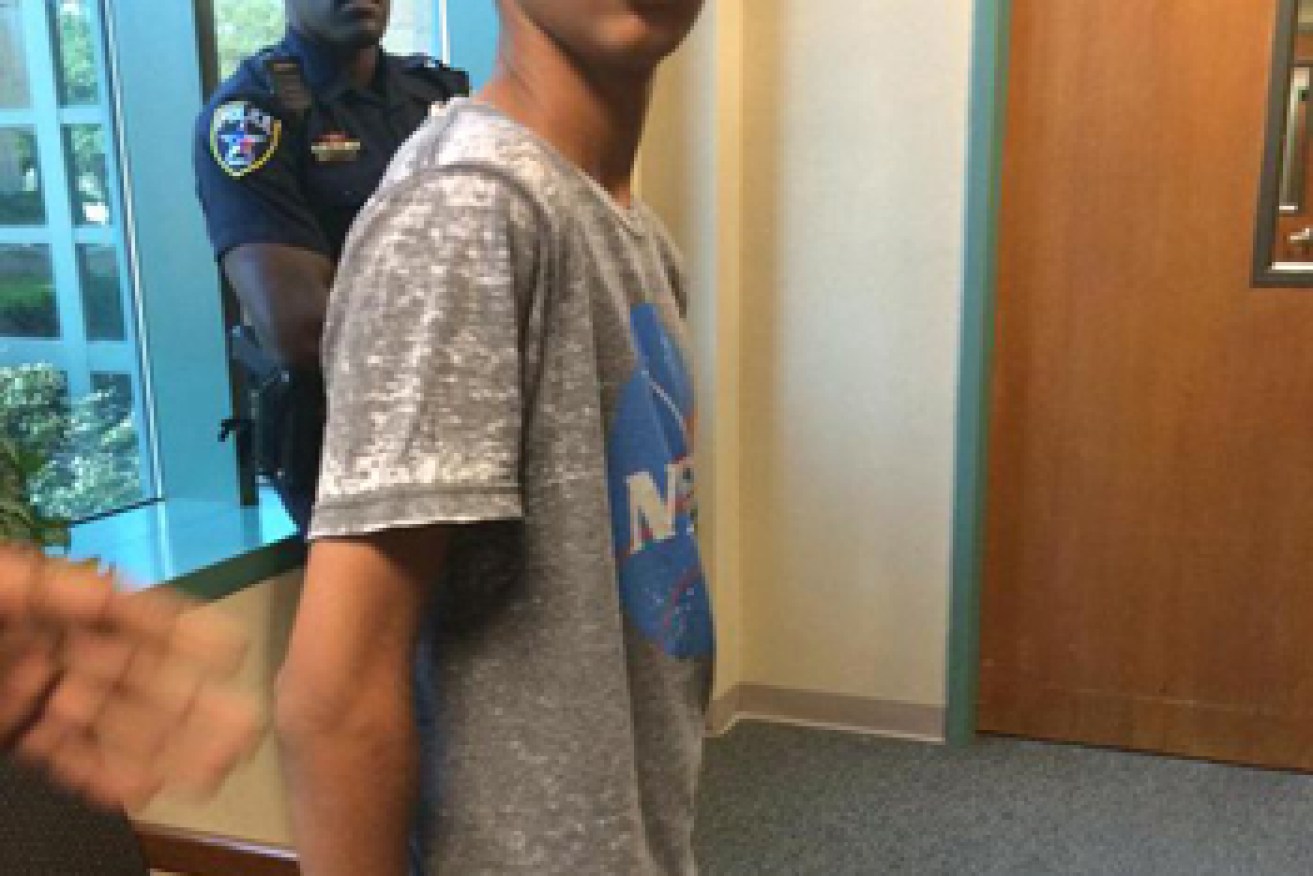 The boy was arrested and handcuffed. Photo: Twitter