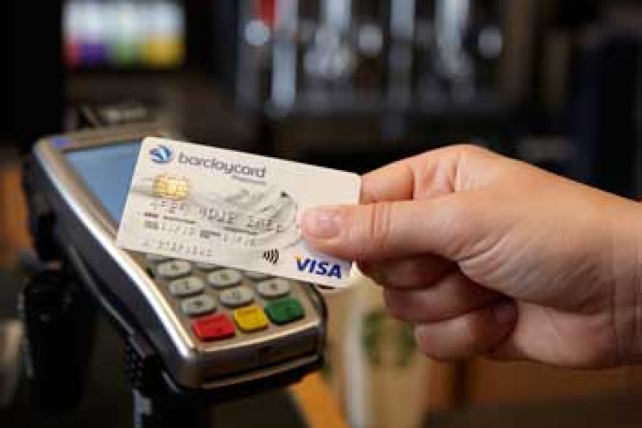Interchange fees are applied by the card issuer's bank to the merchant's bank for use of the card. Photo: AAP