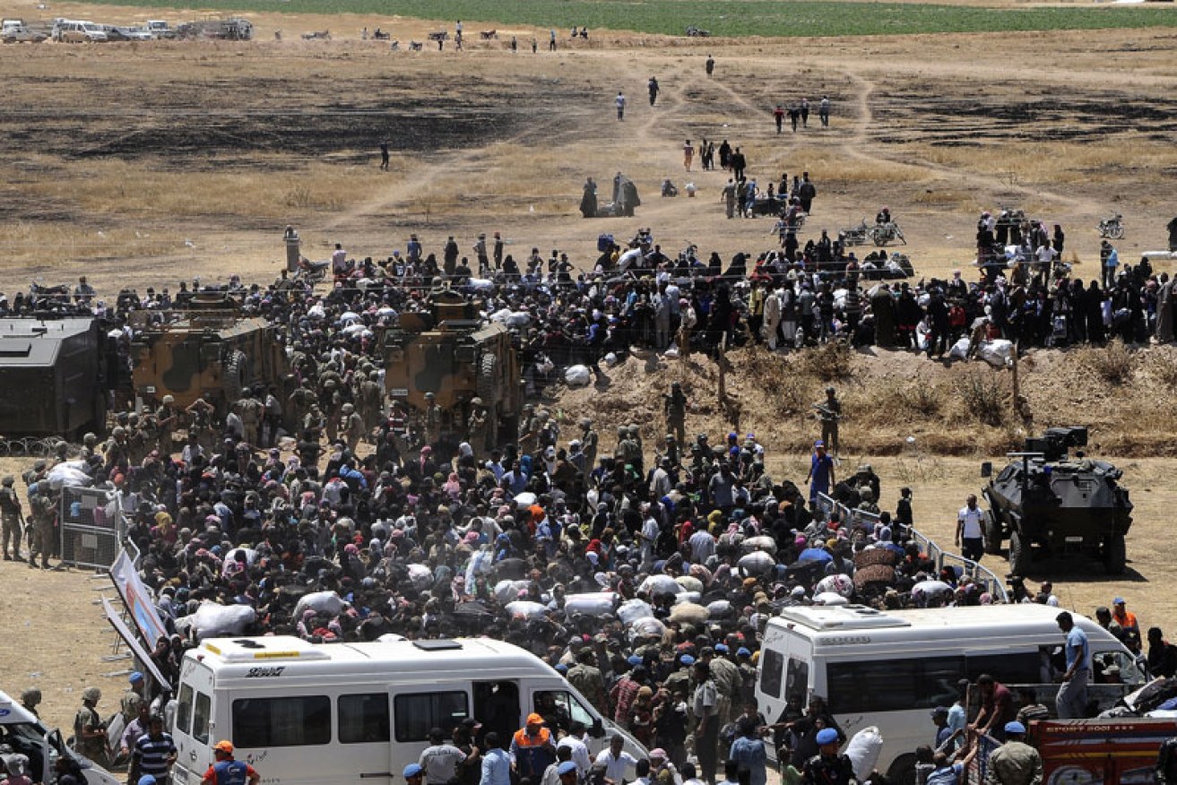 Syrian refugees escape violence between Islamic State and rebel groups. Photo: Getty