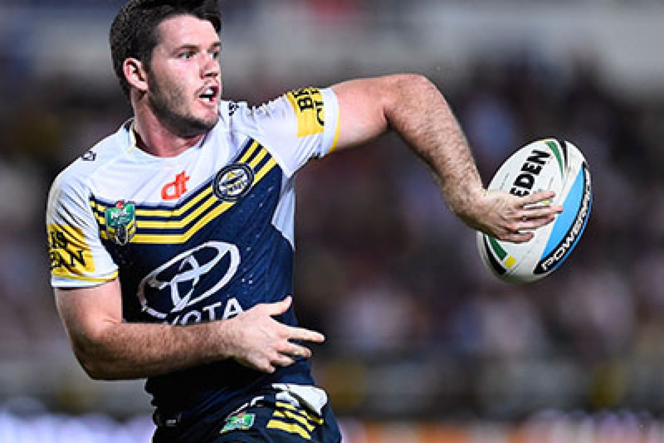 TOWNSVILLE, AUSTRALIA - JUNE 27:  Lachlan Coote of the Cowboys passes the ball during the round 16 NRL match between the North Queensland Cowboys and the Cronulla Sharks at 1300SMILES Stadium on June 27, 2015 in Townsville, Australia.  (Photo by Ian Hitchcock/Getty Images)