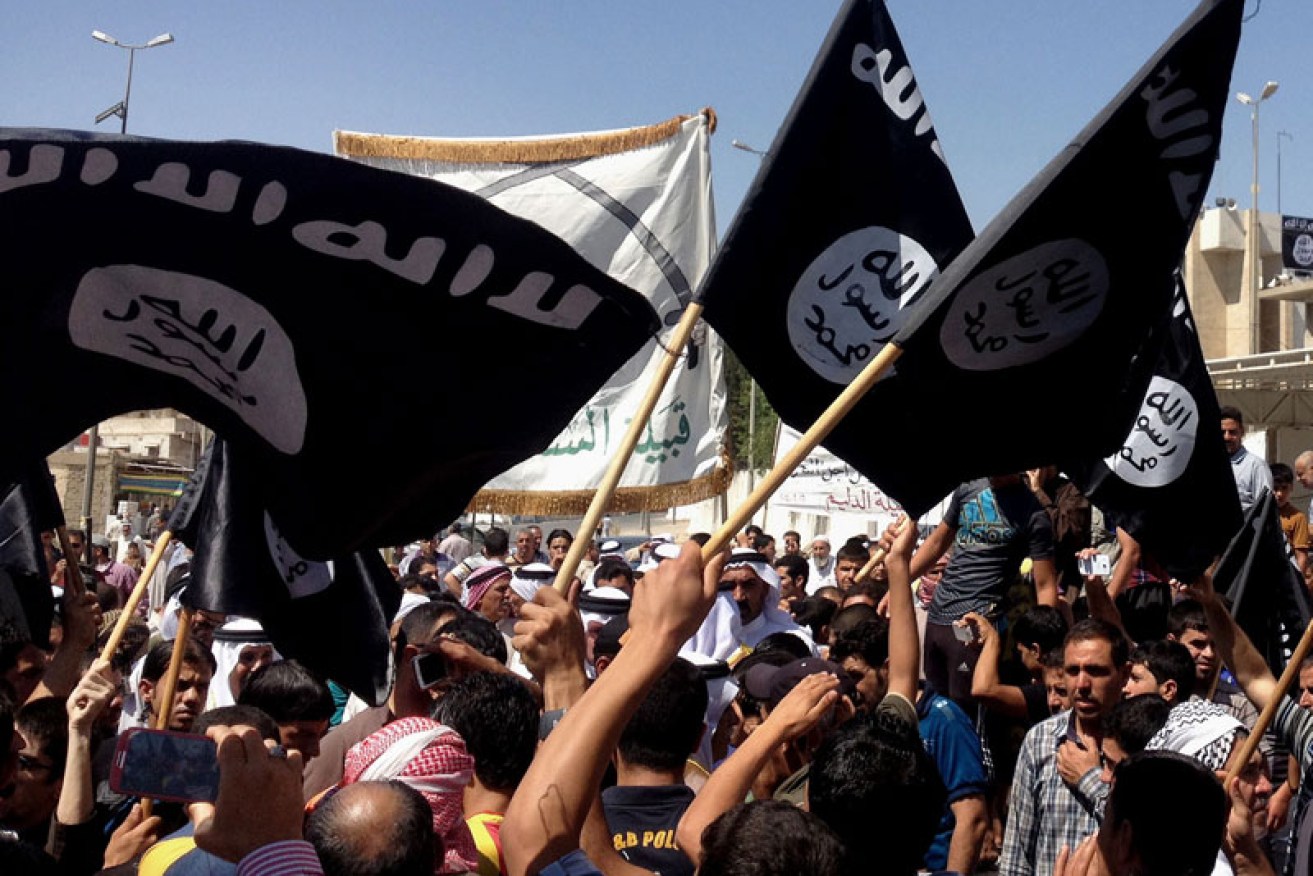 Islamic State flags being waved in Mosul, Iraq.