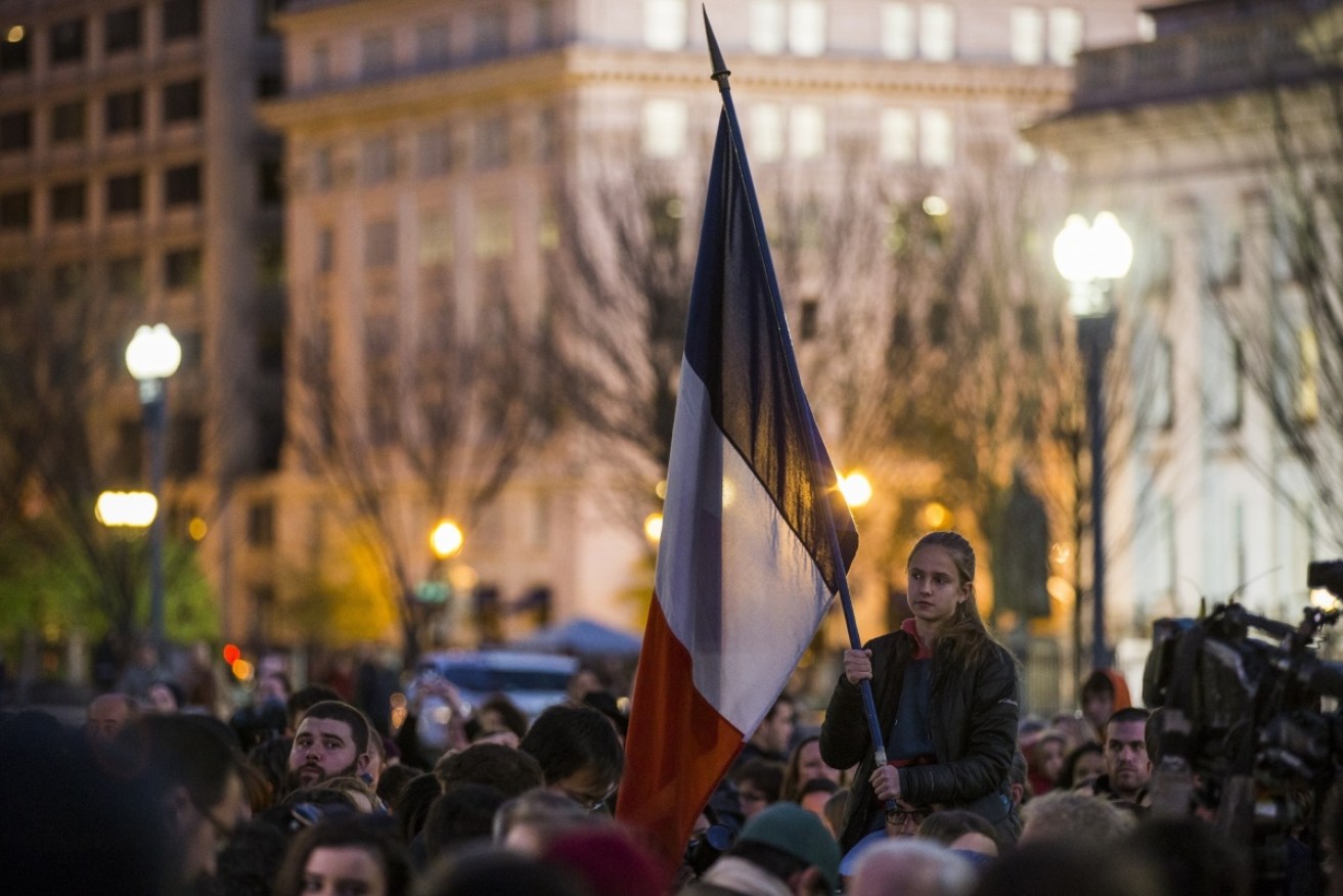 A flag is flown at a vigil in Washington D.C. Photo: Getty