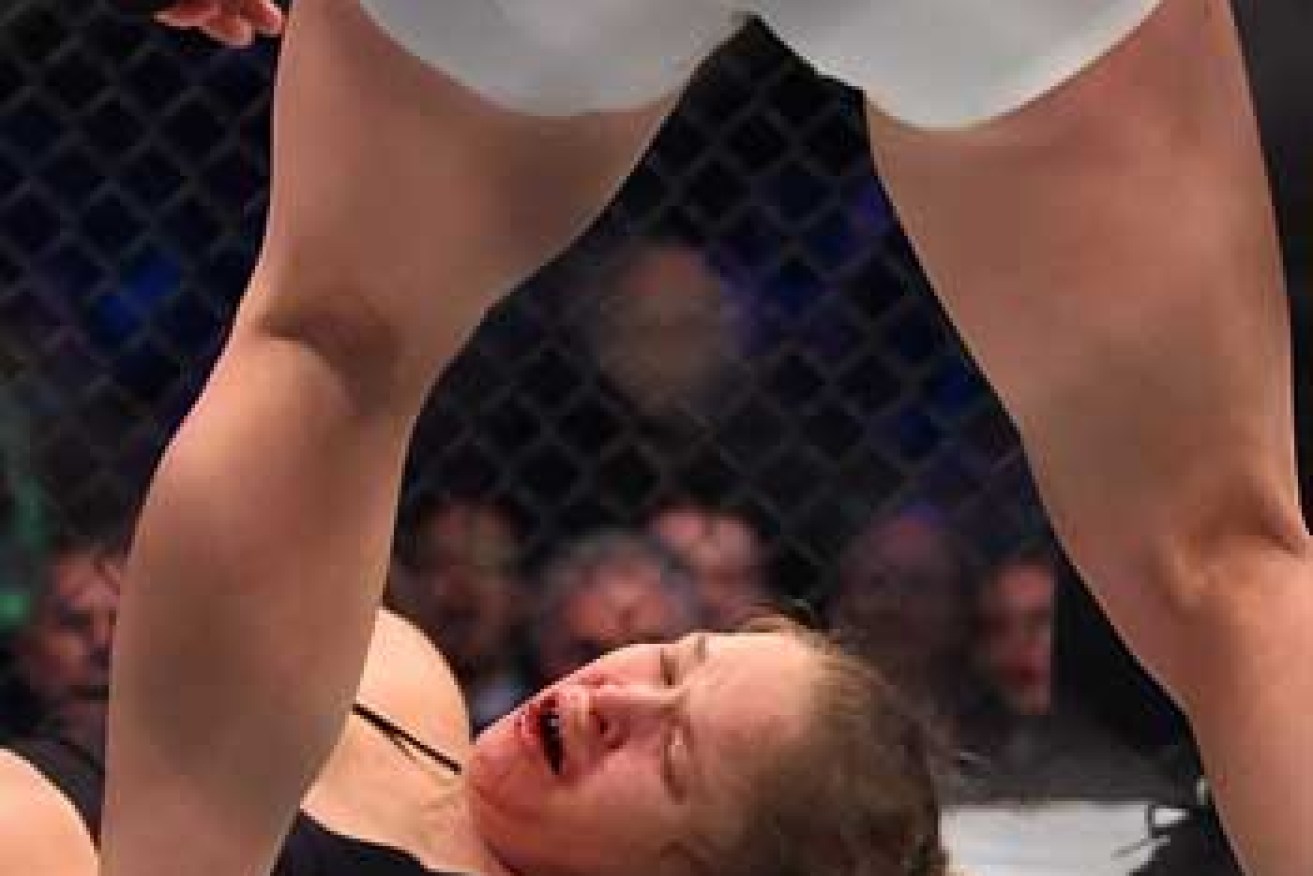 The fight was over 59 seconds into round two when a Holm kick connected with Rousey's jaw. Photo: Getty