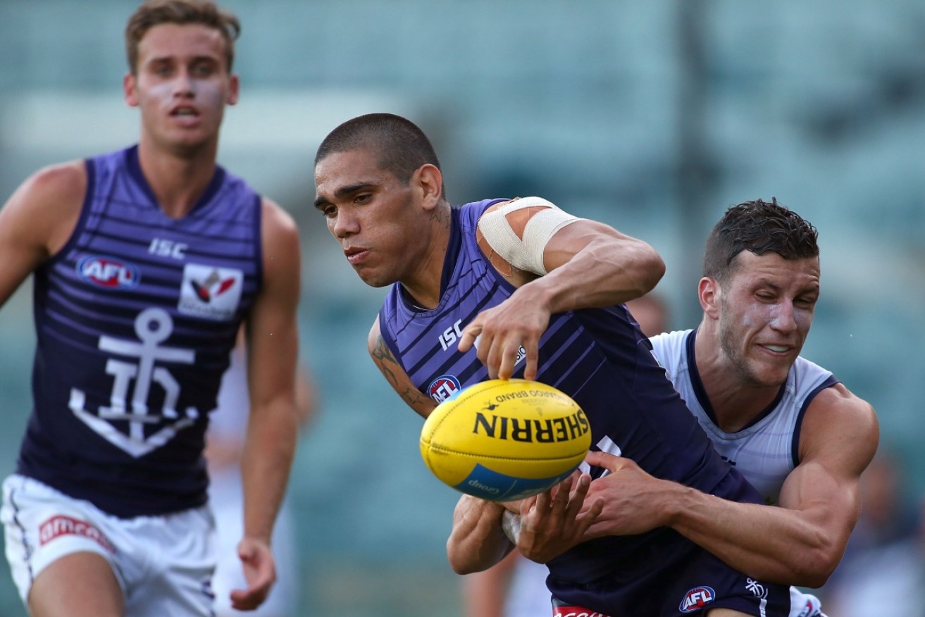 Sam Menegola gets to grips with Michael Walters at Fremantle training. Photo: Getty