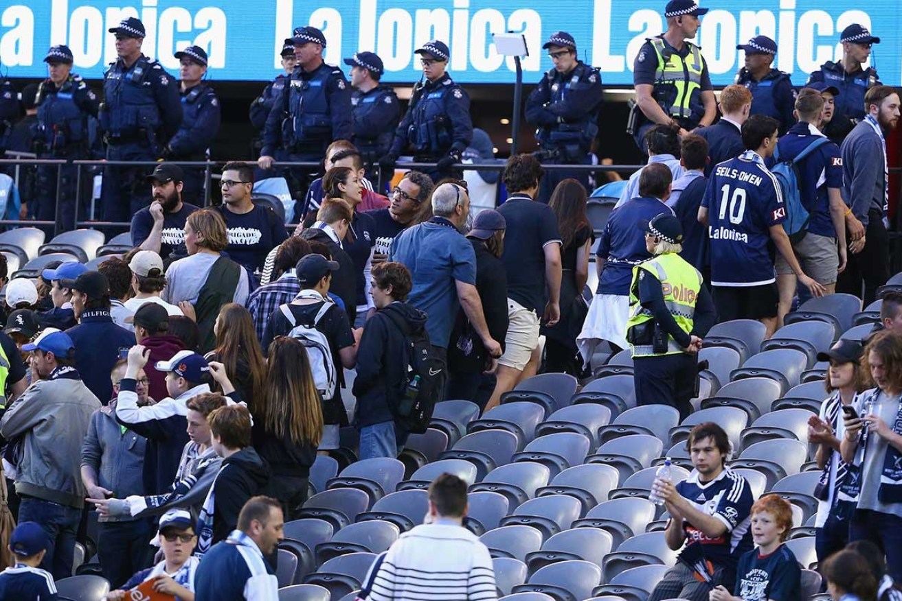 Melbourne Victory fans walk out of their clash with Adelaide. 