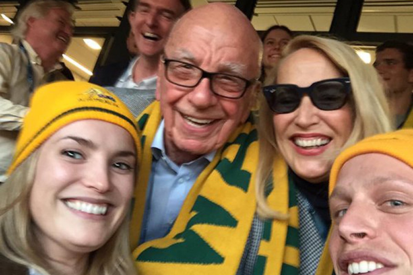 It's a date: Rupert Murdoch and Jerry Hall at the Rugby World Cup.