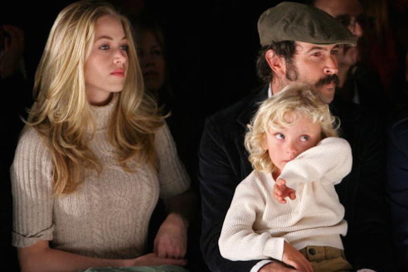 Beth Riesgraf (left) and fiancee Jason Lee with their child, Pilot Inspektor Riesgraf-Lee. Photo: Getty