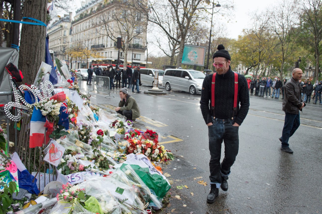 Hughes at a memorial for Le Bataclan victims. Getty
