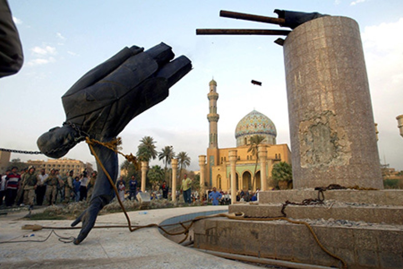Liberated by U.S. led troops, thousands of jubilant Iraqis celebrated the collapse of Saddam Hussein murderous regime, beheading a toppled statue of their longtime ruler in the center of Baghdad and looting government sites.