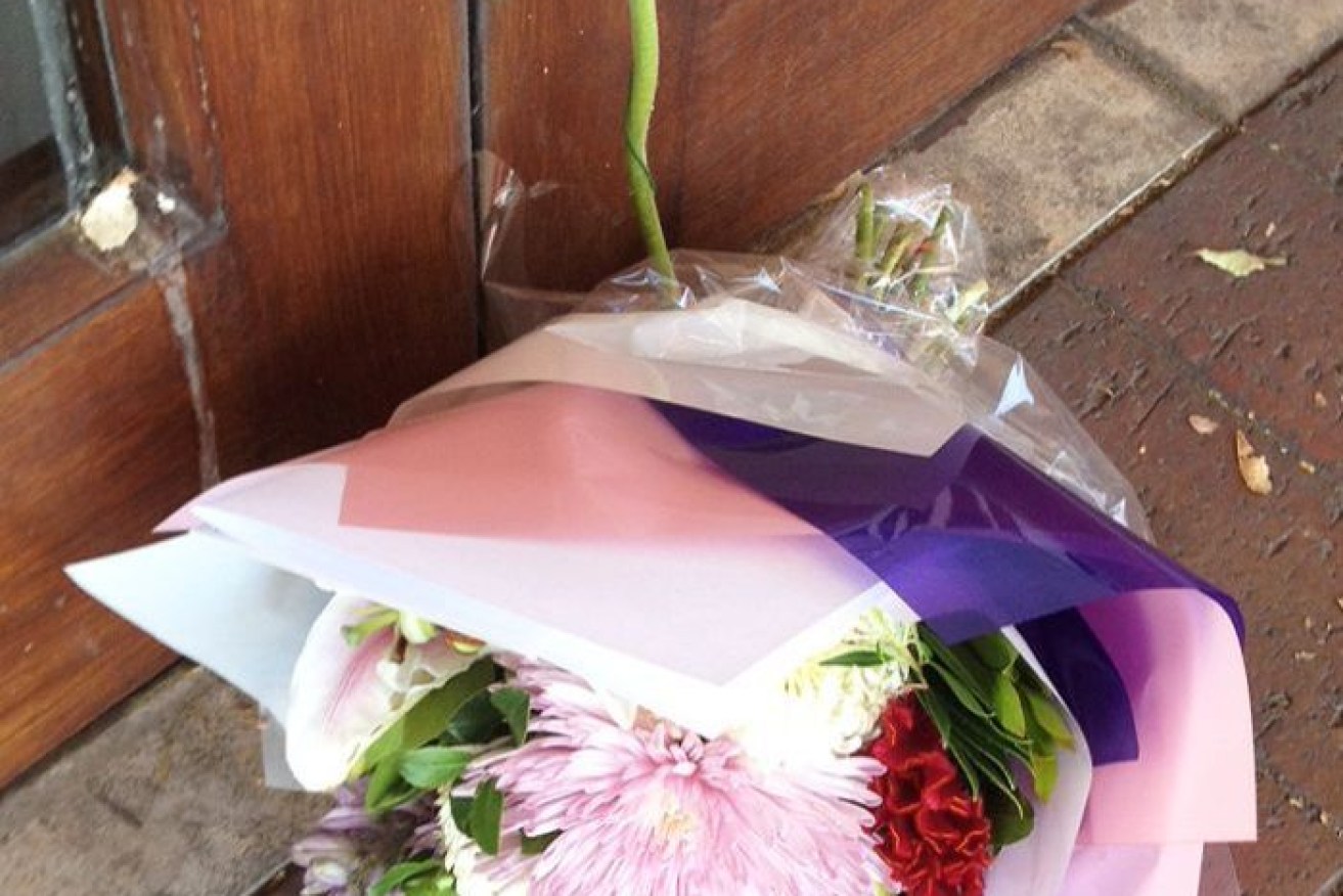 Flowers were laid outside the Datta family's Urban India restaurant on Henley Beach Road. Photo: Candice Marcus
