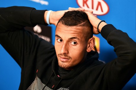Kyrgios answers phone on court, dodges fine