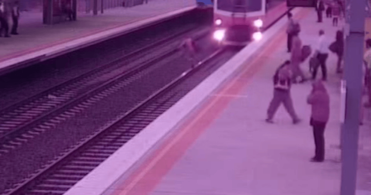 Video: near miss for man running over train tracks | The New Daily