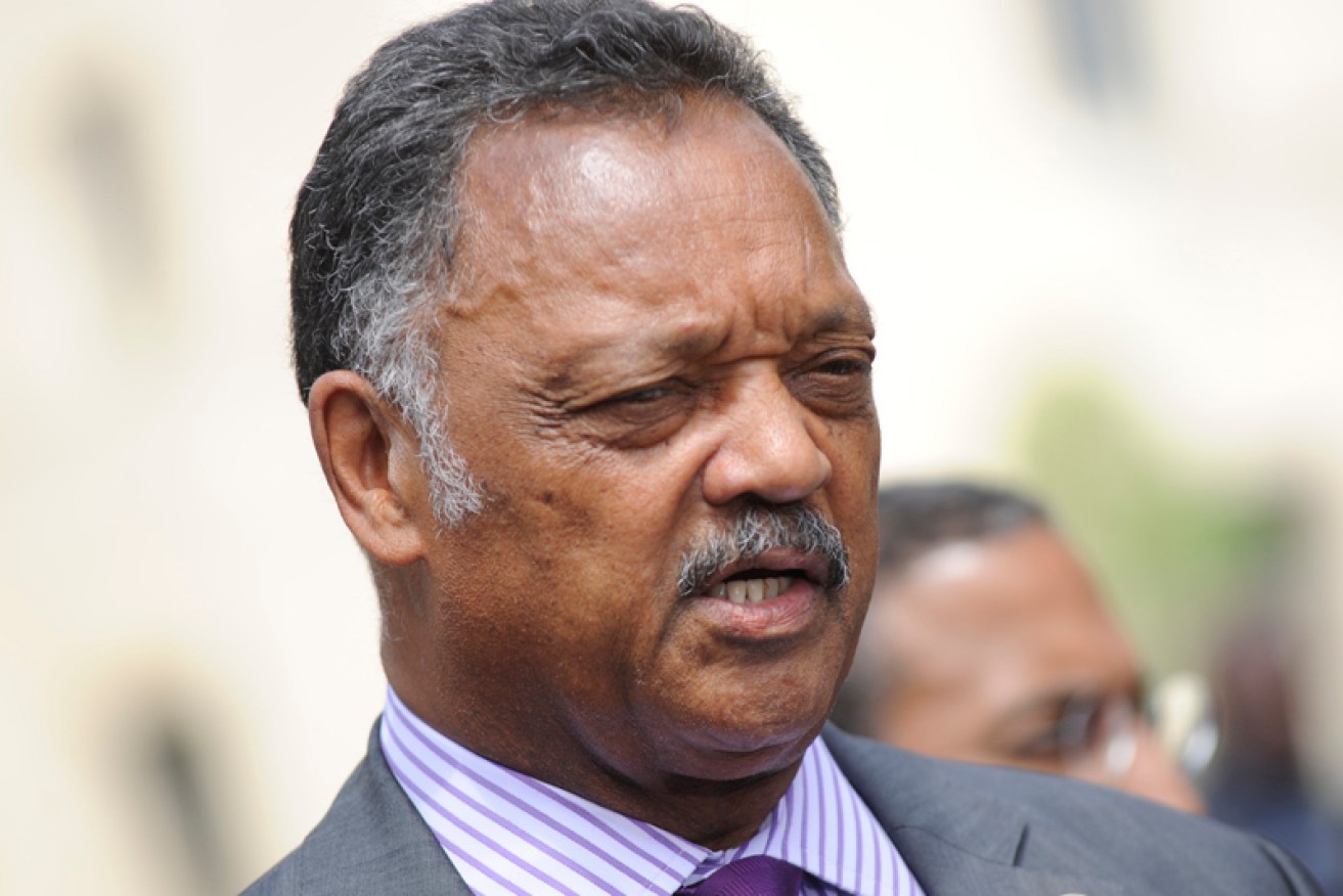 Jesse Jackson throws his support behind the Apple chief.
Photo by Kris Connor/Getty Images