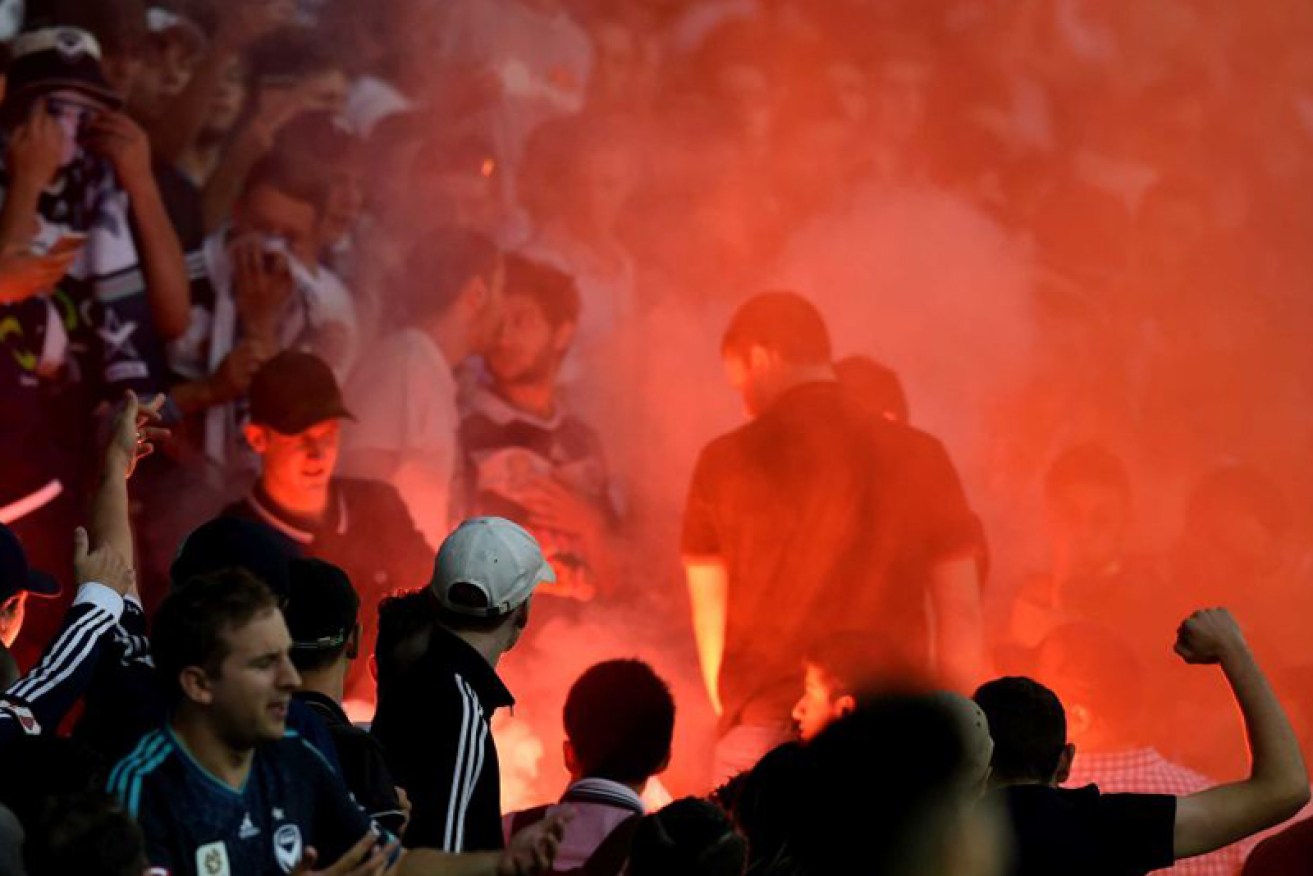 Soccer thugs with flares have been a blight on A-League matches, but last night fans policed themselves. AAP: Tracey Nearmy