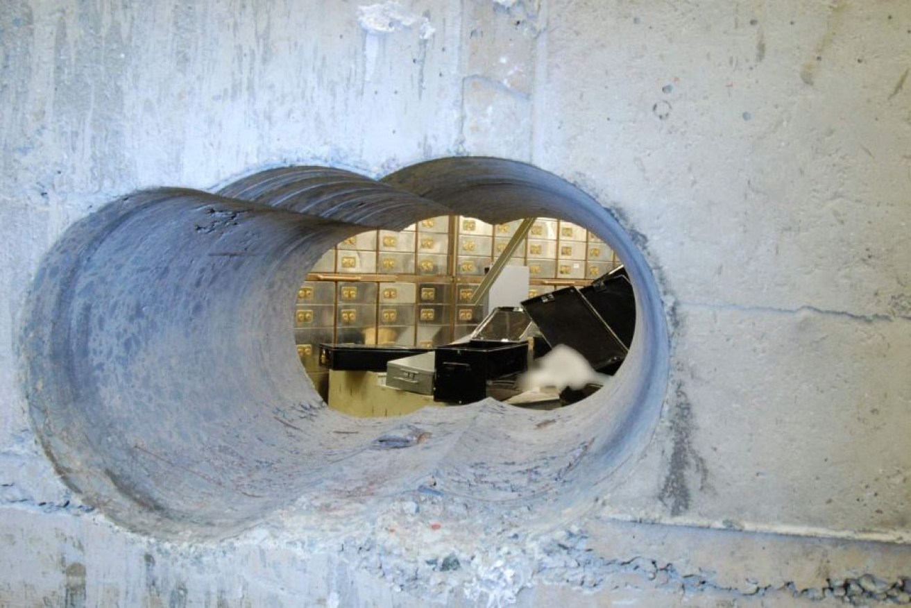 The hole the men bored to access the vault. Photo: Metropolitan Police