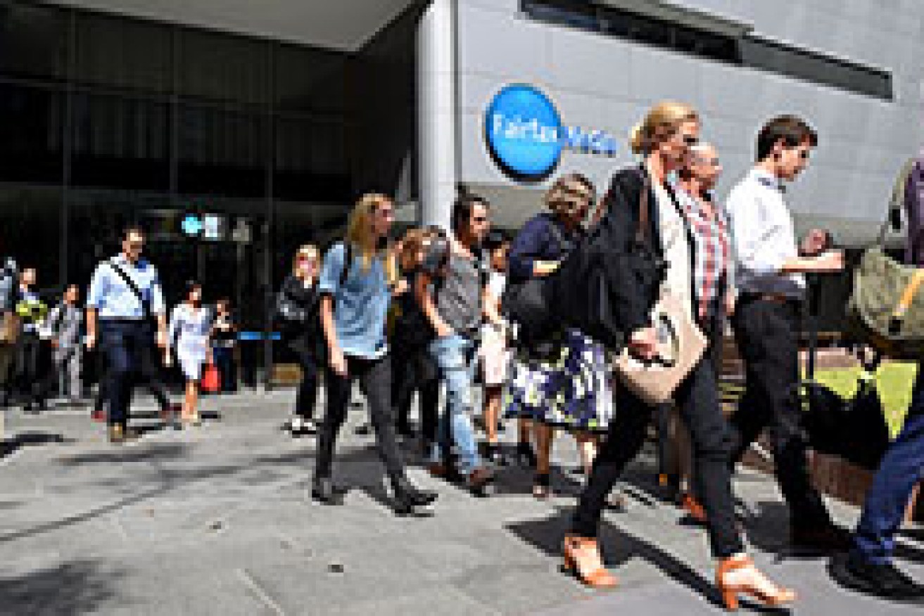 Editorial staff are seen walking out of Fairfax Media headquarters in Sydney, Thursday, March 17, 2016. The company announced today 120 editorial positions would be cut, and in response staff voted to walk off the job until Monday. (AAP Image/Dan Himbrechts) NO ARCHIVING