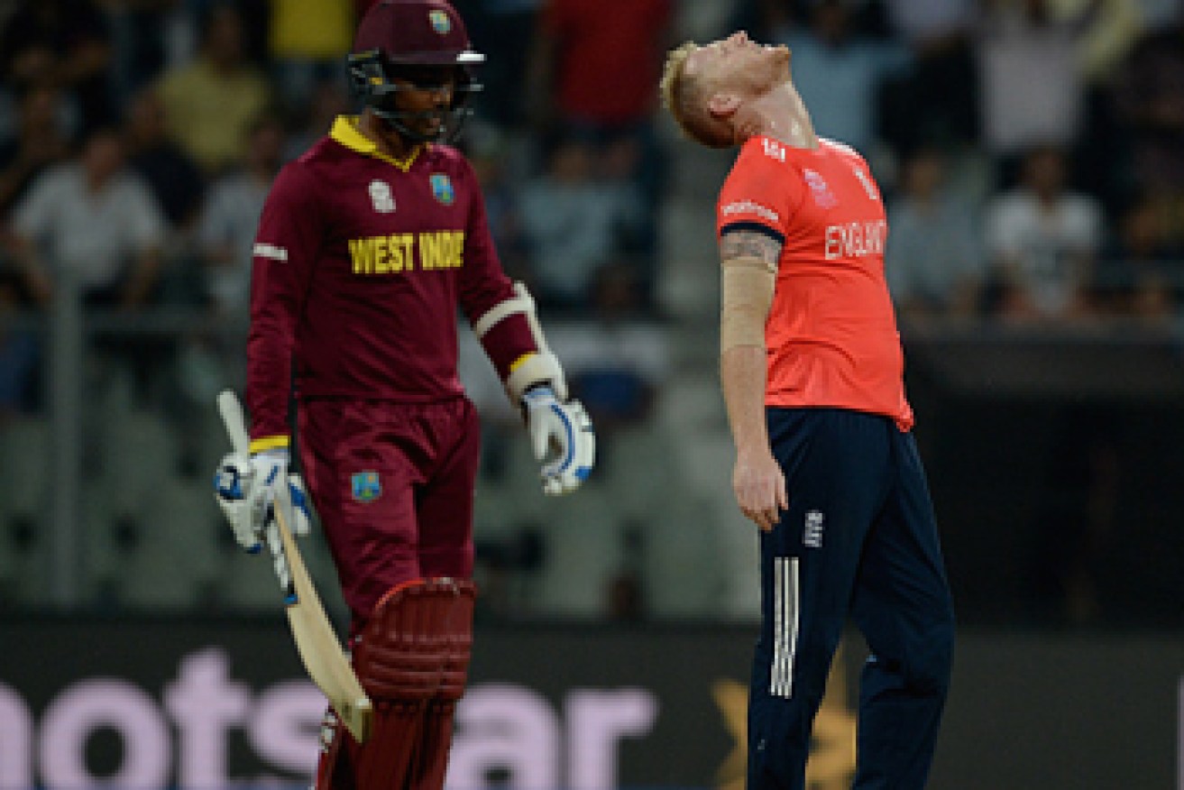English bowler Ben Stokes reacts to being hit for six by Gayle. Photo: Getty