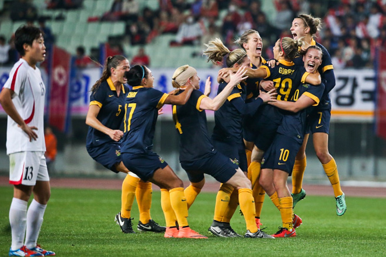The Matildas celebrate Katrina Gorry's winning goal against North Korea that sealed Olympic qualification. Photo: Getty