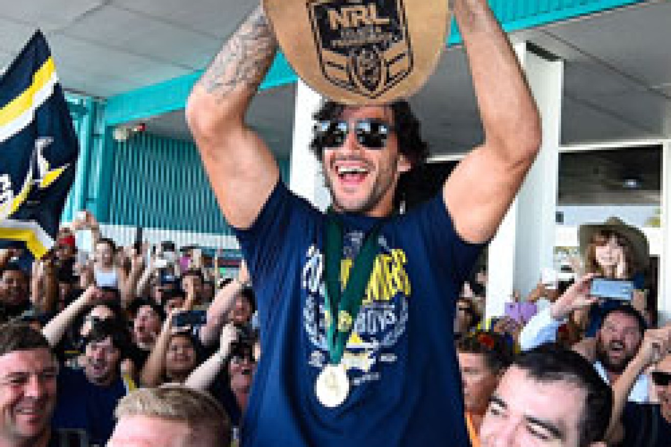 The King of Townsville: Johnathan Thurston celebrates last year's grand final triumph. Photo: Getty