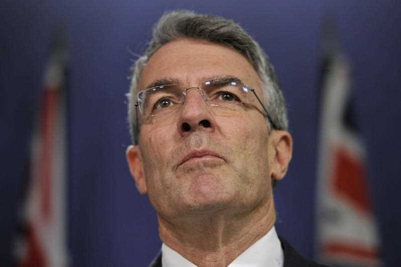 Mr Dreyfus has repeated calls for Mr Brandis to resign. Photo: AAP.