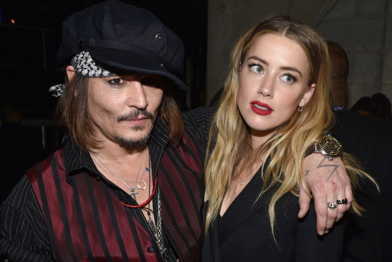 Johnny Depp and Amber Heard are pictured at the 58th GRAMMY Awards in February last year