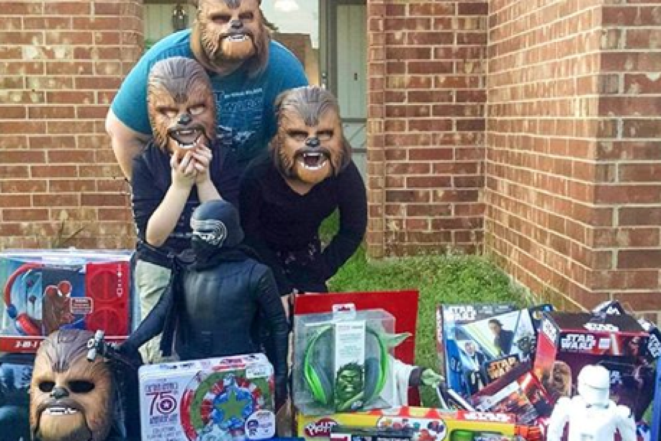 Ms Payne and her children pose with the new masks and gifts from Kohl's. Photo: Facebook