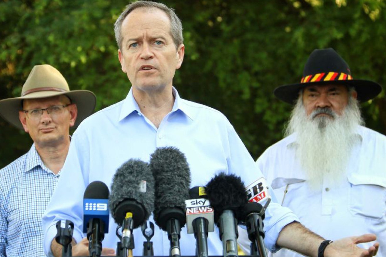 Mr Shorten, with Shayne Neumann (left) and Pat Dodson (right) 
speaks about racism.