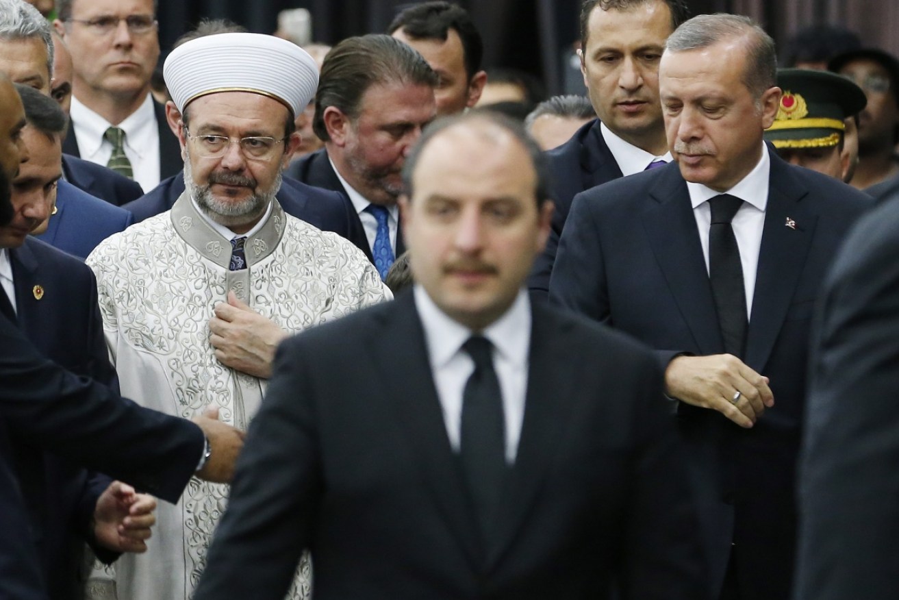 Turkish cleric Mehmet Gormez (L) and Turkish President Recep Tayyip Erdogan (R). Photo: AAP.