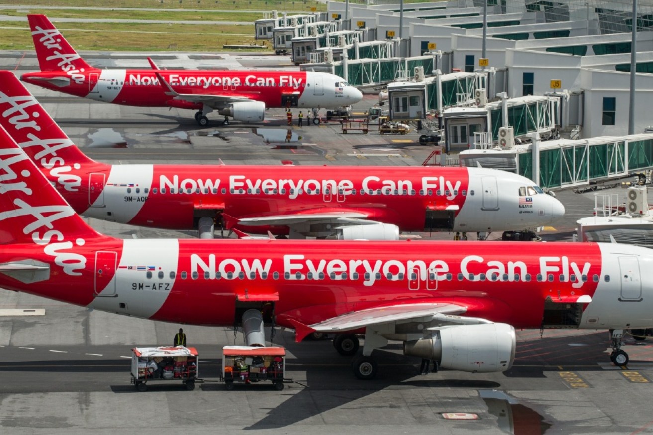 An Air Asia flight was forced to return to Brisbane after a mid-air emergency.
