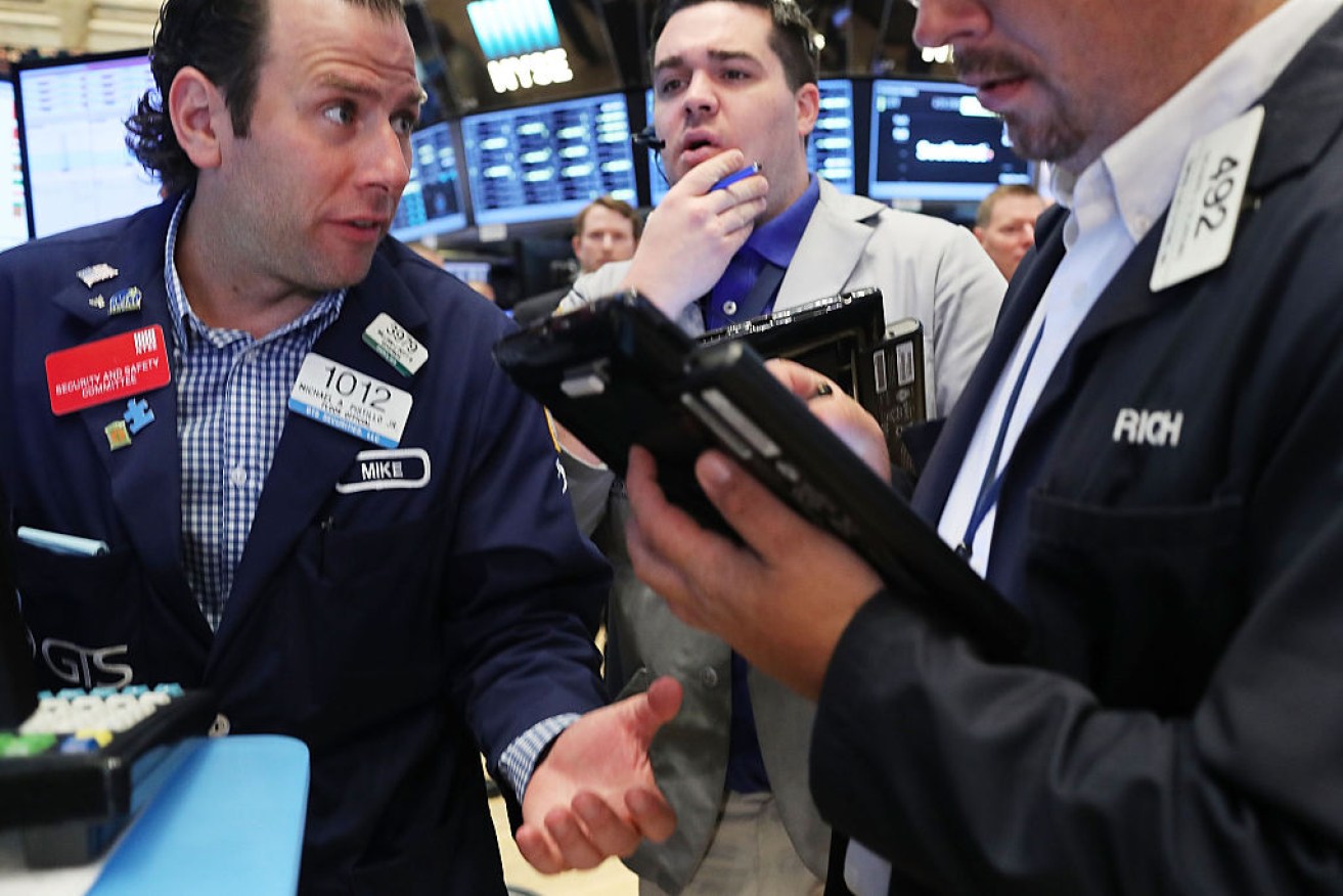 Traders on the floor of the New York Stock Exchange (NYSE). Photo: Getty. 