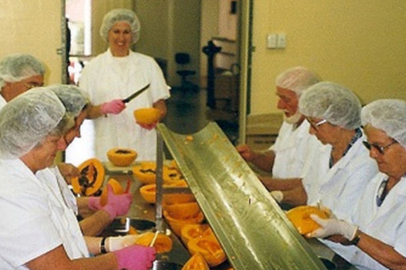 Lucas employees hard at work peeling papaws in the Brisbane factory. Photo: Supplied