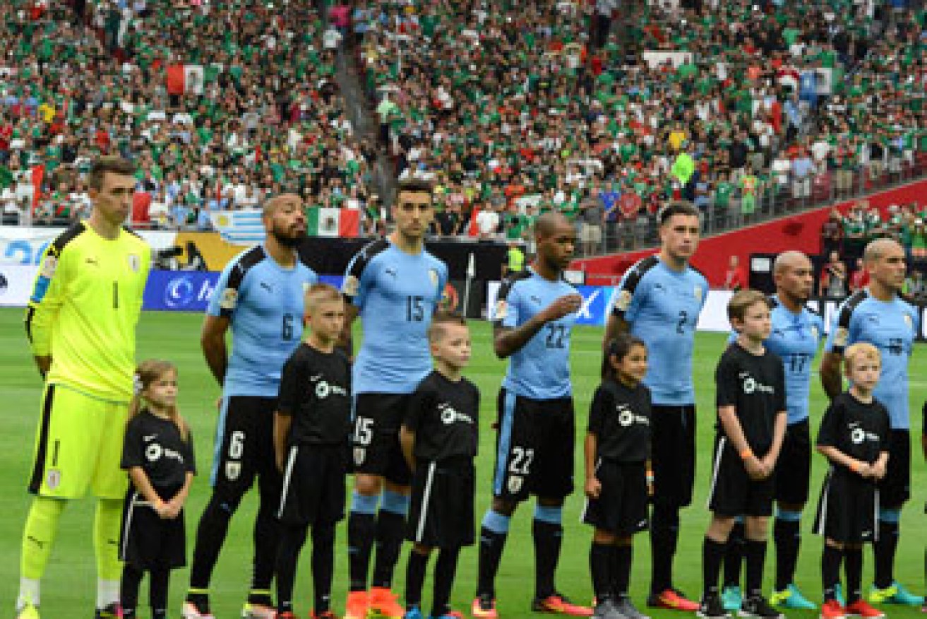 Uruguay players look bemused. Photo: Getty