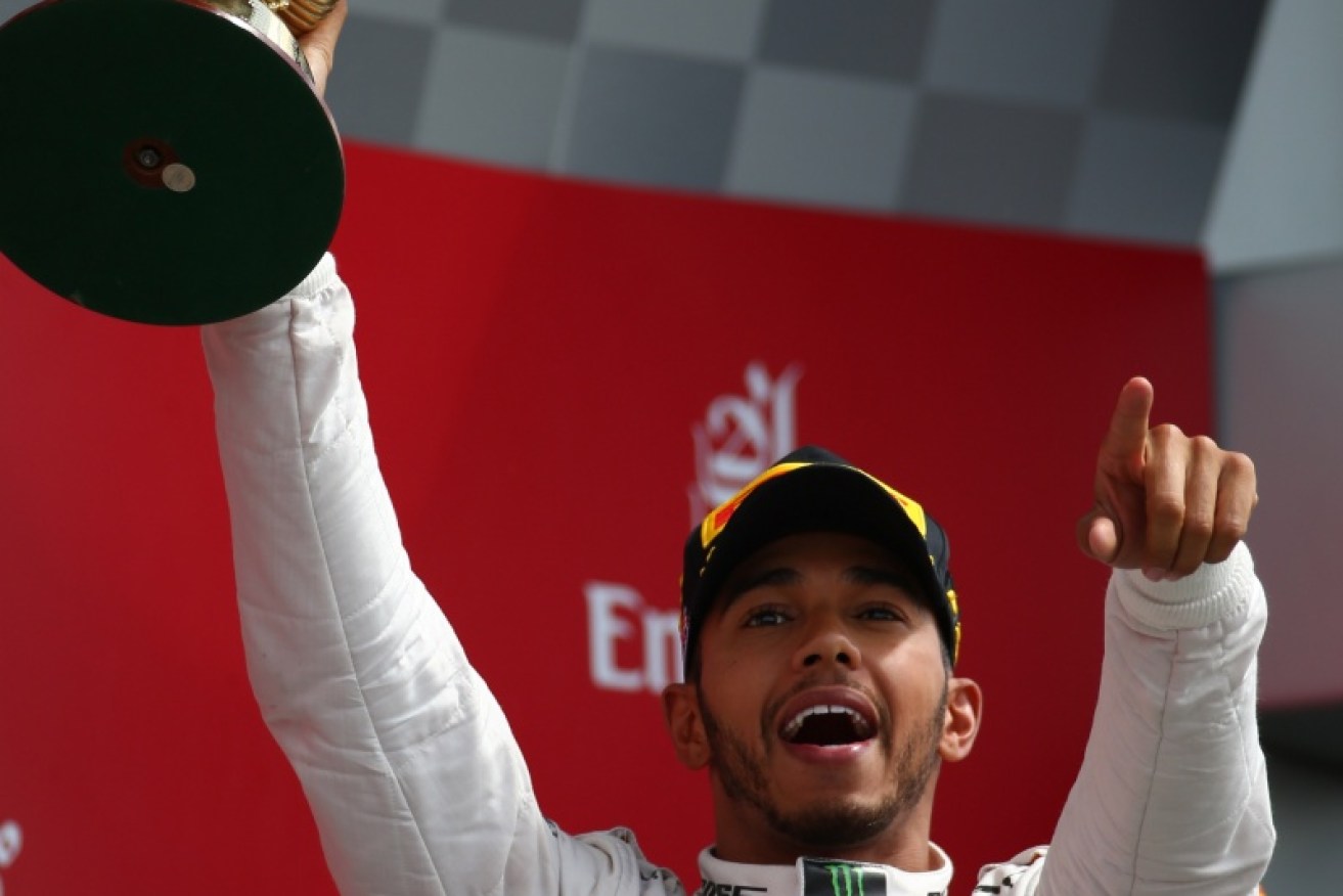 Lewis Hamilton on the podium after his British Grand Prix win. Photo: AAP